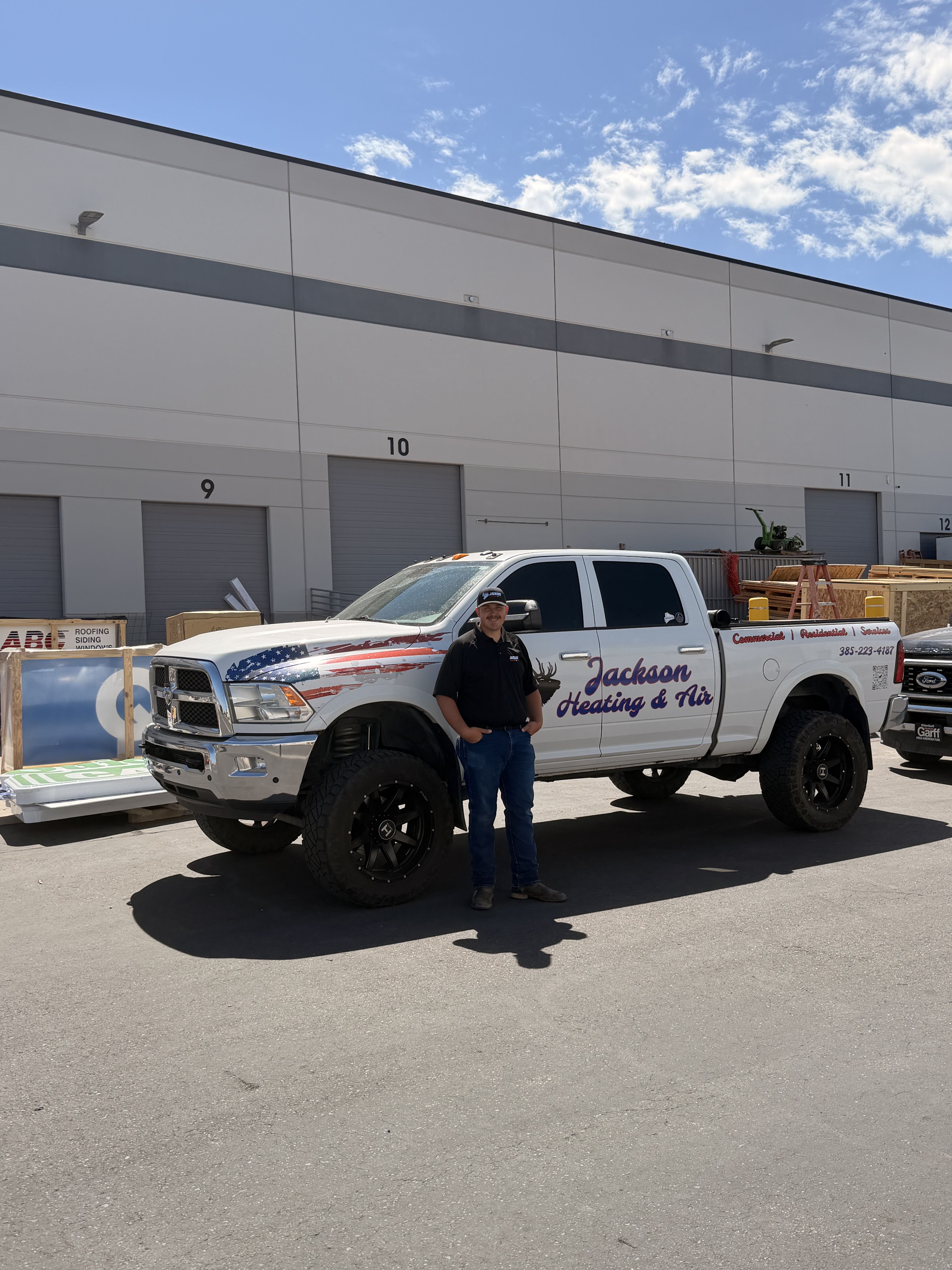 Jackson Heating & Air technician with company service truck